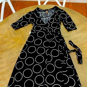Black abstract print wrap dress